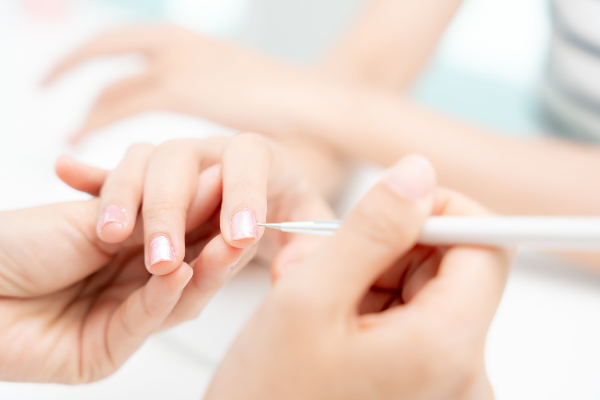 Woman receive care service by professional Beautician Manicure at spa centre. Nail beauty salon use nail file for Glazing treatment. manicurist make nail customer to beautiful. body care spa treatment